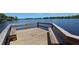 Waterfront dock featuring built-in seating and panoramic views of the calm lake and horizon at 821 N Lake Claire Cir, Oviedo, FL 32765