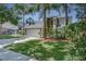 Beautiful home with a two-car garage, well-manicured lawn, mature trees, and inviting curb appeal at 821 N Lake Claire Cir, Oviedo, FL 32765