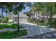 Attractive two-story house with a two-car garage, manicured lawn, and beautiful mature trees at 821 N Lake Claire Cir, Oviedo, FL 32765