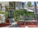 Inviting front entrance with double doors, decorative plants, and a charming bench at 821 N Lake Claire Cir, Oviedo, FL 32765