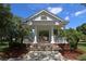 Gazebo featuring white pillars and a roof with palm trees surrounding it at 821 N Lake Claire Cir, Oviedo, FL 32765