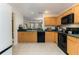Bright kitchen features tile flooring, ample counter space, and wooden cabinetry at 821 N Lake Claire Cir, Oviedo, FL 32765