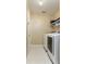 Practical laundry room with modern appliances and ample storage space at 821 N Lake Claire Cir, Oviedo, FL 32765