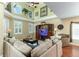 Spacious living room boasting soaring ceilings and plentiful natural light at 821 N Lake Claire Cir, Oviedo, FL 32765