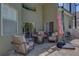 Inviting outdoor patio with comfortable seating and a cozy fire pit, perfect for relaxing and entertaining at 821 N Lake Claire Cir, Oviedo, FL 32765