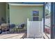 Relaxing patio area with comfortable seating, a side table and screened-in enclosure at 821 N Lake Claire Cir, Oviedo, FL 32765
