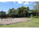 View of playground featuring swings and slide near trees in the community at 821 N Lake Claire Cir, Oviedo, FL 32765
