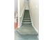 Carpeted staircase with white railing leading to the upper level of the home at 821 N Lake Claire Cir, Oviedo, FL 32765