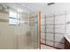 Tiled bathroom features glass enclosed shower and modern fixtures at 825 Mellowood Ave, Orlando, FL 32825