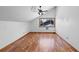 Spacious bedroom with hardwood floors and a large window offering natural light at 825 Mellowood Ave, Orlando, FL 32825