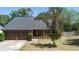 Charming home featuring a two-car garage and well-maintained landscaping at 825 Mellowood Ave, Orlando, FL 32825
