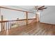 Open hallway with wood flooring and a modern ceiling fan at 825 Mellowood Ave, Orlando, FL 32825