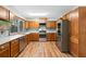 Well-lit kitchen featuring stainless steel appliances and stylish backsplash for a modern touch at 825 Mellowood Ave, Orlando, FL 32825