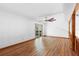 Spacious living room with hardwood floors, a ceiling fan and glass sliding doors at 825 Mellowood Ave, Orlando, FL 32825