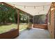 Screened-in patio with string lights overlooks the backyard and outdoor space at 825 Mellowood Ave, Orlando, FL 32825