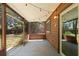 Covered, screened in patio with access to the backyard at 825 Mellowood Ave, Orlando, FL 32825