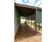 Relax on this covered back patio with lattice details, offering a cozy outdoor space for entertaining and relaxation at 8325 Sun Vista Way, Orlando, FL 32822