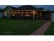 Backyard patio area with outdoor hammock and hanging lights perfect for enjoying warm summer evenings at 8325 Sun Vista Way, Orlando, FL 32822