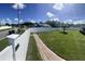 Spacious backyard with a brick walkway and a privacy fence, ideal for outdoor activities at 8325 Sun Vista Way, Orlando, FL 32822