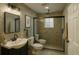 Luxurious bathroom with double toilets, modern fixtures, and a spacious shower at 8325 Sun Vista Way, Orlando, FL 32822