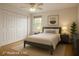 Comfortable bedroom with ample closet space, neutral tones, and natural light at 8325 Sun Vista Way, Orlando, FL 32822