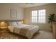Serene bedroom featuring sconce lighting, bedside tables, and a calming atmosphere at 8325 Sun Vista Way, Orlando, FL 32822