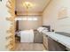 Cozy bedroom features a comfortable bed, a neutral color palette, and a stylish desk area, perfect for relaxation at 8325 Sun Vista Way, Orlando, FL 32822