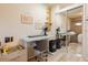 Well-lit room featuring a desk and fan, creating a comfortable and functional workspace at 8325 Sun Vista Way, Orlando, FL 32822