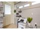 Cozy home office nook with a drafting table, modern wall decor and natural light at 8325 Sun Vista Way, Orlando, FL 32822