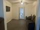 Cozy living room with a sofa and flat-screen TV, complemented by a ceiling fan at 8325 Sun Vista Way, Orlando, FL 32822
