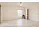 Large Primary bedroom features tile floors, a ceiling fan, a closet, and a window with natural light at 8325 Sun Vista Way, Orlando, FL 32822