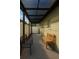 Covered back patio featuring seating and brick paving, perfect for outdoor relaxation at 8325 Sun Vista Way, Orlando, FL 32822