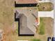 Aerial shot of the home's roof, driveway, and surrounding property at 8509 Sw 136Th Loop, Ocala, FL 34473
