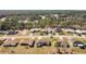 Aerial view of homes surrounded by trees in a neighborhood at 8509 Sw 136Th Loop, Ocala, FL 34473