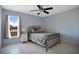 Bedroom featuring natural light, tile floors and a ceiling fan at 8509 Sw 136Th Loop, Ocala, FL 34473