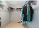 Walk-in closet with tile flooring and built-in shelving and hanging rods at 8509 Sw 136Th Loop, Ocala, FL 34473