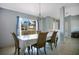 Dining room with natural light, tile floor and a view to the entry way at 8509 Sw 136Th Loop, Ocala, FL 34473