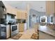 Cozy kitchen featuring neutral cabinets and modern appliances at 8509 Sw 136Th Loop, Ocala, FL 34473