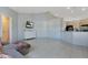 Spacious living room with tile flooring and a view to the kitchen at 8509 Sw 136Th Loop, Ocala, FL 34473