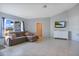 Comfortable living room with a large window that lets in ample natural light at 8509 Sw 136Th Loop, Ocala, FL 34473