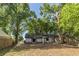 View of the home's rear exterior and backyard at 3673 Westland Ct, Orlando, FL 32818