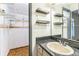 Bathroom featuring a sink, mirror, and nearby closet at 3673 Westland Ct, Orlando, FL 32818