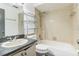 Modest bathroom featuring a sink, toilet, bathtub, and a shower head at 3673 Westland Ct, Orlando, FL 32818