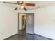 Bedroom featuring overhead fan, window and door to other rooms at 3673 Westland Ct, Orlando, FL 32818