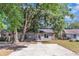 Charming single-story home with a spacious driveway and mature trees at 3673 Westland Ct, Orlando, FL 32818