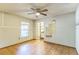 A simple living room with unique tile flooring, overhead fan and natural light at 3673 Westland Ct, Orlando, FL 32818