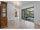 Elegant dining room with chandelier, tile flooring, and a view to the outdoor patio at 10030 Cheshunt Dr, Orlando, FL 32817