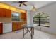 Cozy kitchen with charming cabinetry, tile flooring, and a bright window for natural light at 10030 Cheshunt Dr, Orlando, FL 32817