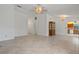 Open living space with tile flooring, chandelier, and adjacent kitchen area at 10030 Cheshunt Dr, Orlando, FL 32817
