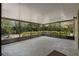 A screened-in patio area with a concrete floor for relaxing outdoors at 10030 Cheshunt Dr, Orlando, FL 32817